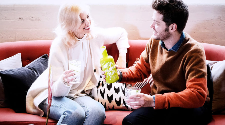 two_people_chatting_while_drinking_fattys_organic_gin_900x